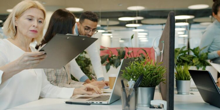 Colleagues collaborating in a modern office environment.